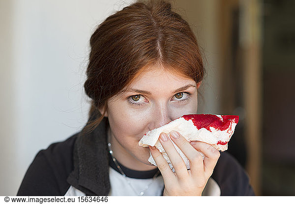 Teenager girl having nosebleed