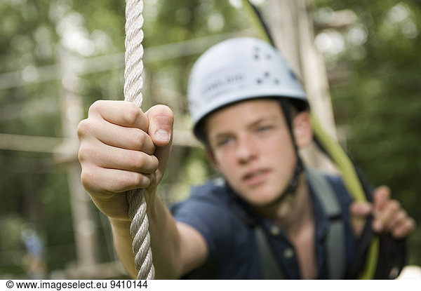 teenager in a climbing crag  close-up