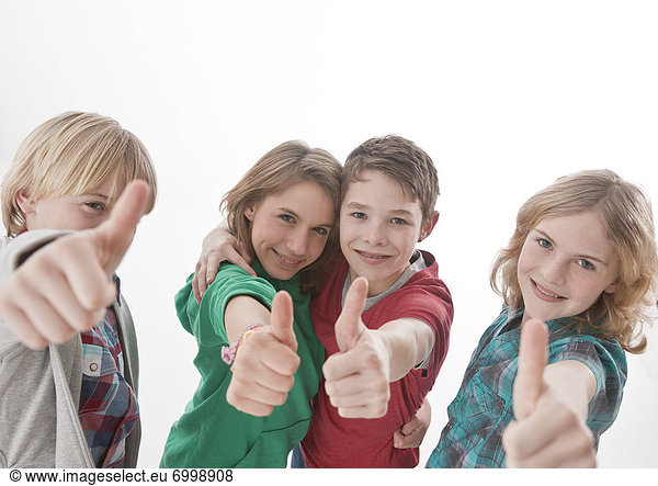 Teenagers giving Thumbs Up