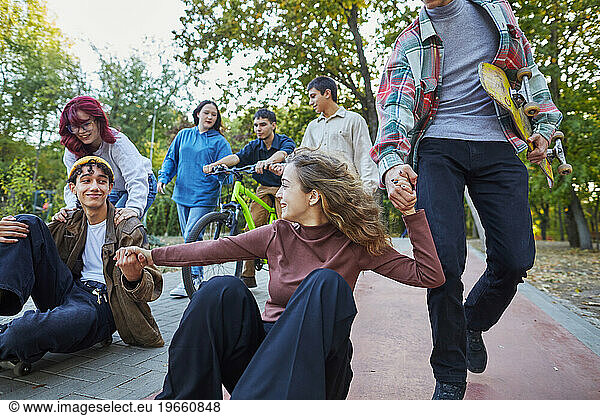 teenagers having fun on skateboards outdoors