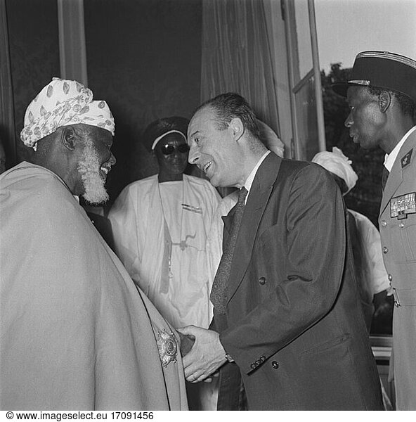 Teitgen  Pierre-Henri; French lawyer and politician (several ministers  leading to the European Convention on Human Rights); Rennes 29.5.1908 – Paris 6.4.1997. / During a reception of high-ranking personalities from the African regions by the French President René Coty in his office  the Élysée Palace  in Paris on 13 July 1955: The Secretary (Politics) for the Overseas Territories  Pierre-Henri Teitgen  in conversation with one of the guests  Photo.