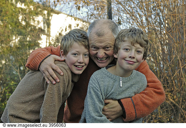 Ten and twelve-year-old boys with their father
