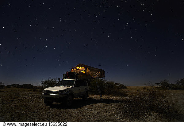 Tent on off-road vehicle on field against sky  Makgadikgadi Pans  Botswana
