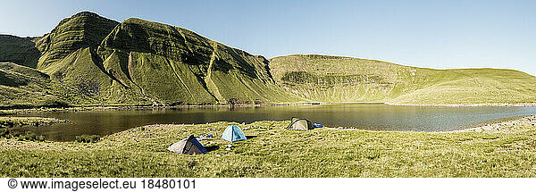 Tents at lakeshore in front of mountains  Brecon Beacons  Wales