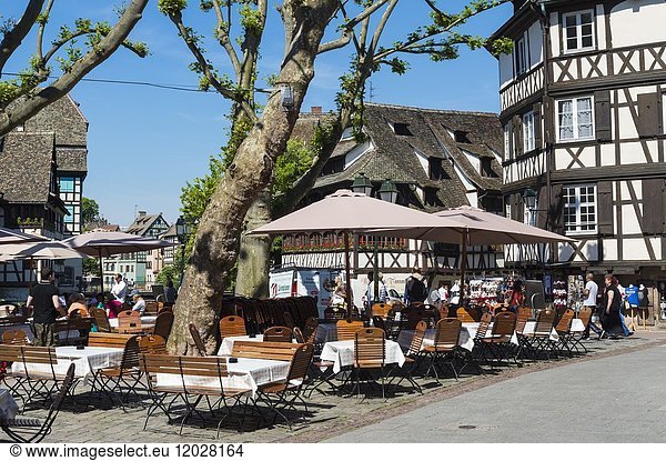 Terrace with tourists in the Petite France district  Strasbourg  Alsace  Bas-Rhin Department  France.