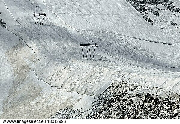 Textile protective covering to delay snow melt on ski slope with ski lift  Presena Glacier  Italian Alps  Italy  Europe