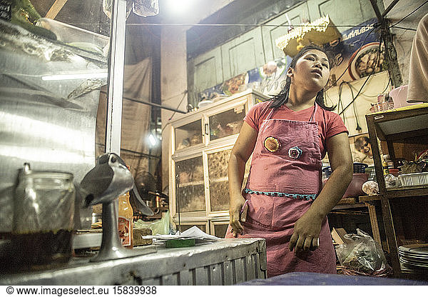 Thai woman working in a street food market