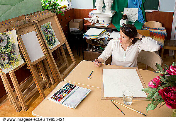 The artist works in her studio