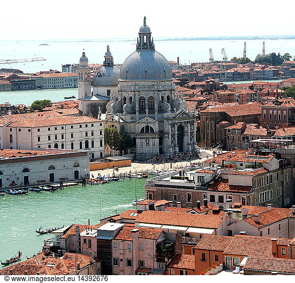The Basilica of St Mary of Health (Santa Maria della Salute)  Roman Catholic church and minor basilica located in the Dorsoduro sestiere of the Italian city of Venice. It stands on a narrow finger of land between the Grand Canal and the Bacino di San Marco making the church visible when entering the Piazza San Marco from the water. In 1630 Venice experienced an unusually devastating outbreak of the plague. As a votive offering for the city"s deliverance from the pestilence  the Republic of Venice vowed to build and dedicate a church to Our Lady of Health (or of Deliverance  Italian: Salute). The church was designed in the then fashionable baroque style by Baldassare Longhena  who studied under the architect Vincenzo Scamozzi. Construction began in 1631.