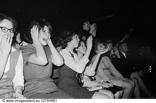 THE BEATLES  1964. Fans screaming during the Beatles concert at the Washington Coliseum in Washington  D.C. Photograph by Marion Trikosko  11 February 1964.