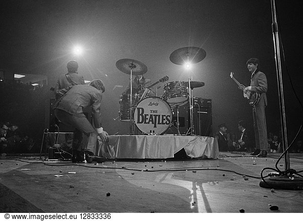 THE BEATLES  1964. The Beatles onstage for their first concert at the Washington Coliseum in Washington  D.C. Photographed by Marion Trikosko  11 February 1964.