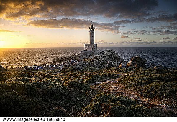 The beautiful lighthouse of Punta Nariga during the sunset. Galicia.