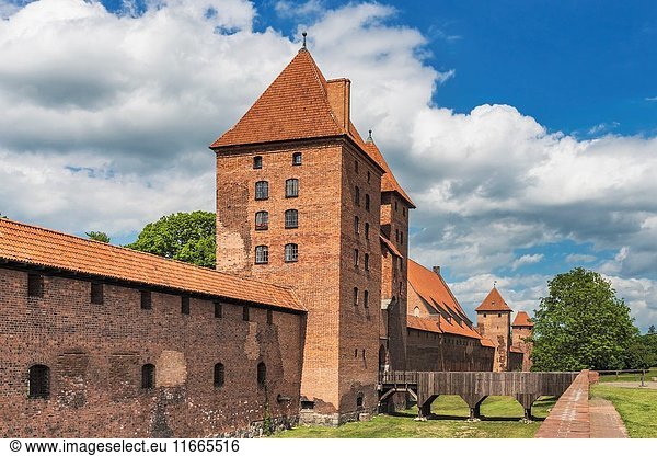 The Castle of the Teutonic Order in Malbork (Zamek w Malborku)  is a castle on the river Nogat. From 1309 to 1454  the castle was seat of the Grand Master of the Teutonic order in the State of the Teutonic Order. The castle complex is the largest brick building in Europe  Malbork  Pomerania  Poland  Europe.