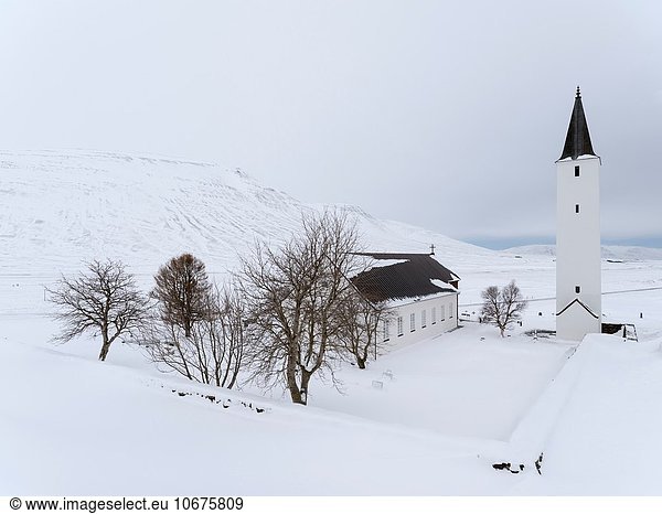 The church of Holar during winter. Holar is a famous archaeological site and is home to the Holar University Collage focusing on agriculture  horse breeding and tourism. europe  northern europe  iceland  March.