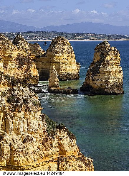 The cliffs and sea stacks of Ponta da Piedade at the rocky coast of the Algarve in Portugal. Europe  Southern Europe  Portugal  March