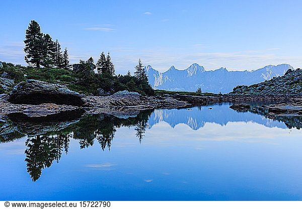 The Dachstein massif plays in Lake Gasselsee  Styria  Austria  Europe