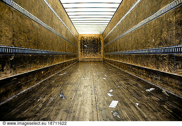 The empty trailer that hauls tires shows the black rubber marks of repeated loads and the patina that it makes.
