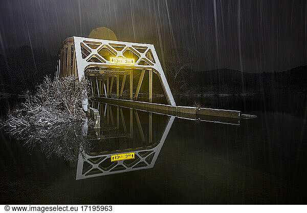 The Flooded Nebraska Bridge At Night in Snowstorm