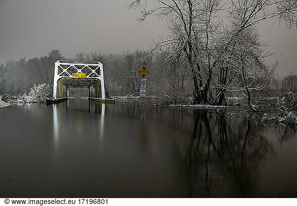 The Flooded Nebraska Bridge At Night in Snowstorm