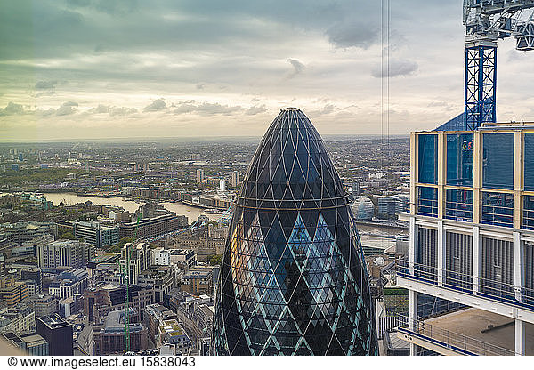 The Gherkin tower seen from above with Thames river on the background