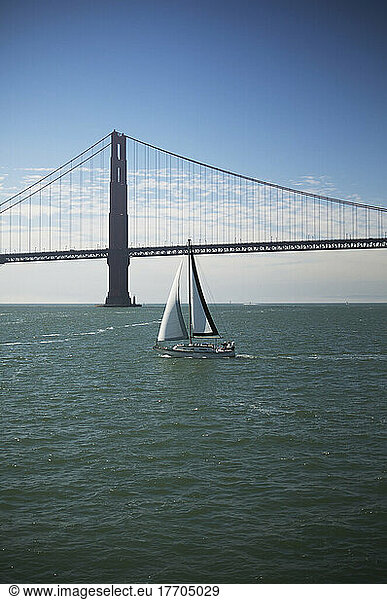 The Golden Gate Bridge Is Seen Behind A Sailboat In San Francisco Bay; San Francisco  California  United States Of America