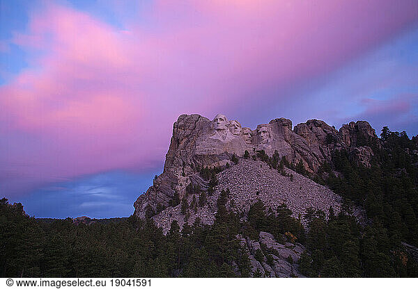 The granite faces of Mount Rushmore National Memorial at sunset in South Dakota  USA