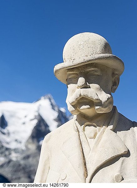 The Grossglockner High Alpine Road is mainly used by tourists and one of the major attractions of the Austrian Alps. Sculpture of Kaiser (emperor) Franz Josef at Kaiser Franz-Josef-Hoehe. Mt. Grossglockner in the background. Europe  Central Europe  Austria  September
