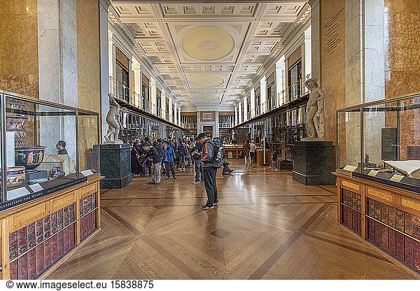 The interior of the british museum with greek antiquities and people