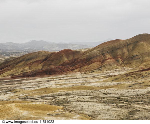 The landscape of the John Day Fossil Beds National Monument  Oregon. Vivid coloured rock strata. Mountains.
