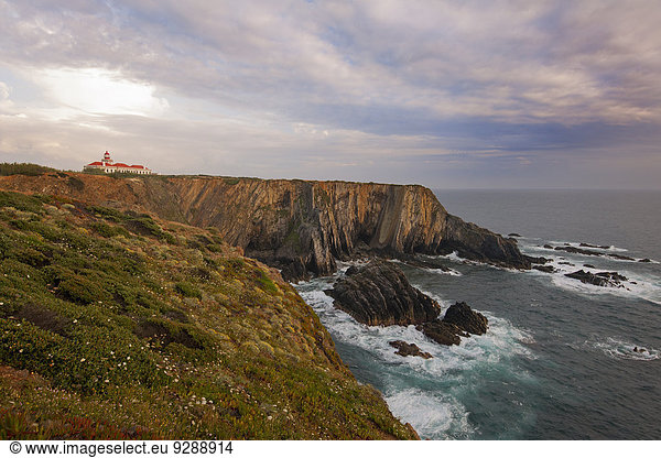 The lighthouse on the headland on the Atlantic coastline.