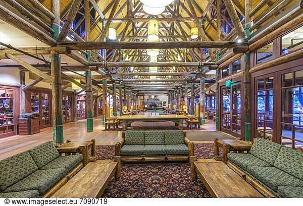 The lobby of the Paradise Inn in Mount Rainier national park. A building with a large seating area.