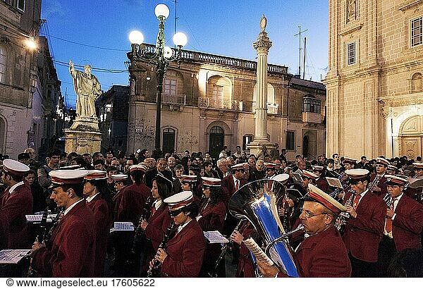 The local band playing marches during the Good Friday procession in front of the Church of St. Sebastian in Qormi  Malta  Europe