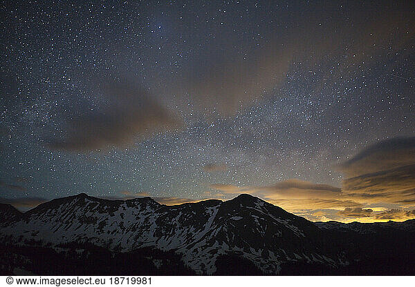 The MIlky Way sparkles in the night sky over the Never Summer Mountains of Colorado.