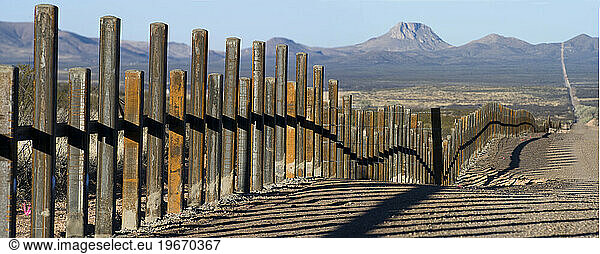The new post & rail border fence runs along the Mexico border with Arizona.