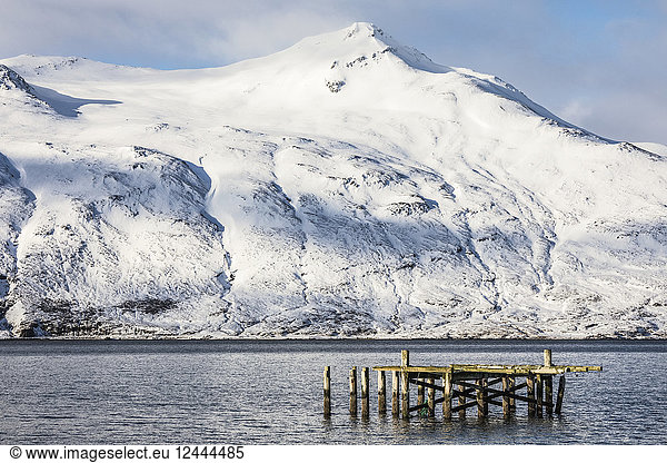 The old dock and snow covered mountains surrounding Djupavik  Djuupavik  West Fjords  Iceland