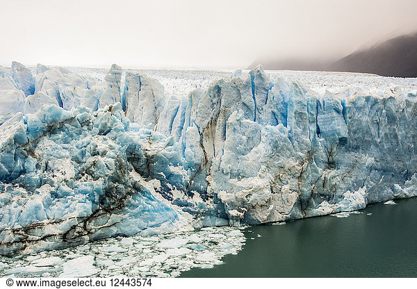 The Perito Moreno Glacier up close showing the blue ice and green water; Cafayate  Santa Cruz Province  Argentina