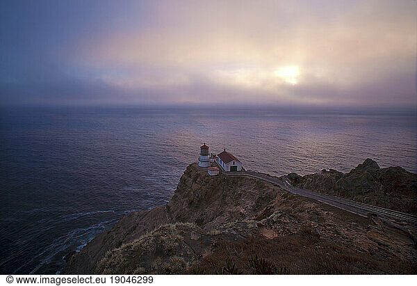The Point Reyes Lighthouse at dusk in the Point Reyes National Seashore along the Pacific Coast in California  USA.