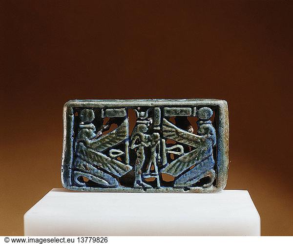 The reverse of a blue faience spacer bead  Isis and Horus appear in the centre with a winged deity on either side. Egypt. Ancient Egyptian. 21st 22nd dynasty c 1085 730 BC. Tuna el Bebel.