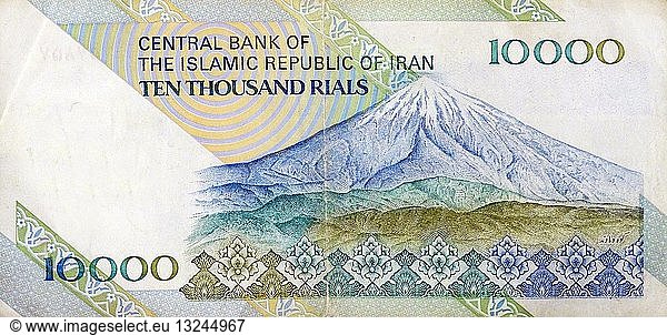 the reverse side of a ten thousand Rial banknote depicting Mount Damavand the highest peak in Iran