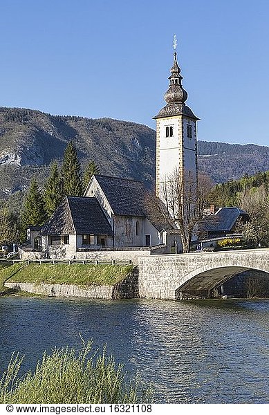 The Romanesque-Gothic church of St. John the Baptist built circa 1100 on the shores of Lake Bohinj outside Ribcev Laz  Upper Carniola  Slovenia.
