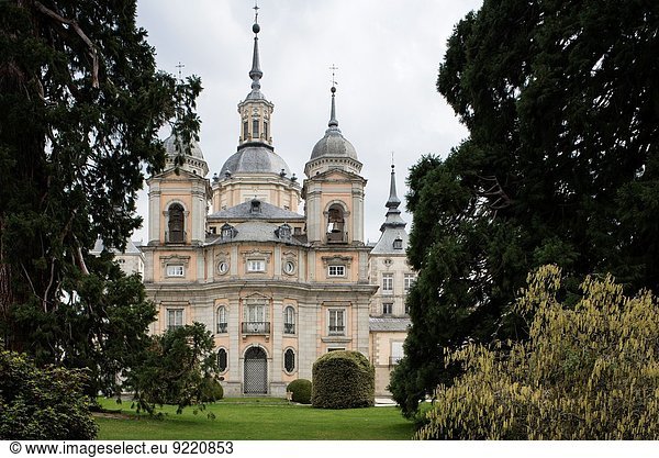 The Royal Palace of La Granja de San Ildefonso is an 18th-century palace in the small town of San Ildefonso in the hills near Segovia formerly the summer residence of the Kings of Spain since the reign of Philip V. The palace is in a restrained baroque style surrounded by extensive gardens in the French manner and sculptural fountains.