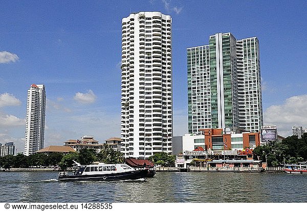 The skyscrapers on the banks of the Chao Phraya River where many five-star tourist hotel are situated in Bangkok City  Thailand  South-east Asia  Asia