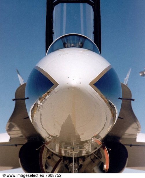 The small numbers on the nose of this F_18 aircraft at NASA’s Dryden Flight Research Center  Edwards  California  show the locations of 11 tiny holes which are an integral part of a new air data system installed on the aircraft. The Real_Time Flush Air Data Sensing system measures the speed and direction of the airflow past the aircraft and its altitude  similar to standard air data systems. It incorporates flush_mounted pressure taps  miniature transducers and an advanced research computer to give pilots more accurate information than standard systems employing external probes can provide. Developed by Dryden researchers in cooperation with Honeywell’s Research and Technology Center  Minneapolis  Minnesota  the system was flight tested on Dryden’s Systems Research Aircraft SRA last year  and is now being used as a precise reference for other air data systems currently being evaluated on the modified F_18.