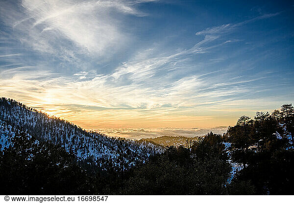 The sun sets in the Angeles National Forest in the winter