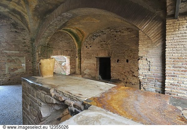 The Thermopolium in front of the House of Diana. The Thermopolium was an ancient roman café where were served hot wine with honey and some food  Ostia Antica. At the mouth of the River Tiber  Ostia was Rome's seaport two thousand years ago. Italy.