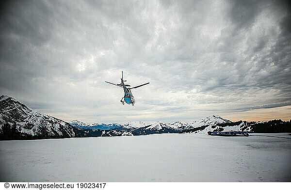 The trackers ensure the safety of the slopes for the skiers  a helicopter evacuates an injured person.