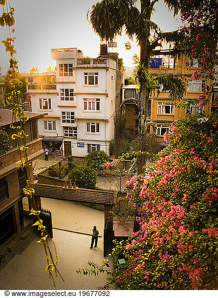 The view of the courtyard  attendant and buildings from the balcony of a hotel in Katmandu  Nepal.