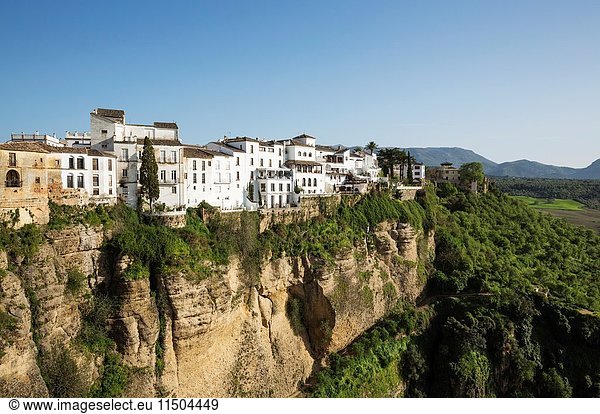 The White Town of Ronda high above the river gorge El Tajo (though the river itself is the Guadalevin). Malaga province  Andalusia  Spain.