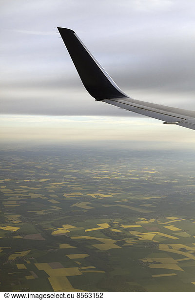 The winglet or wing tip of an aircraft viewed from the passenger window.