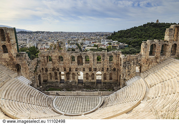 Theatre of Herod Atticus below the Acropolis with the Hill of Philippapos and city view  Athens  Greece  Europe